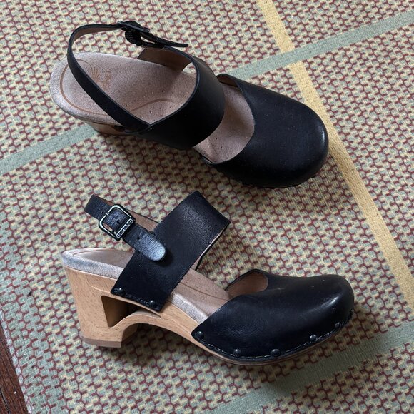 Dansko | Thea Black Leather Cutout Heel Clogs - Picture 1 of 4